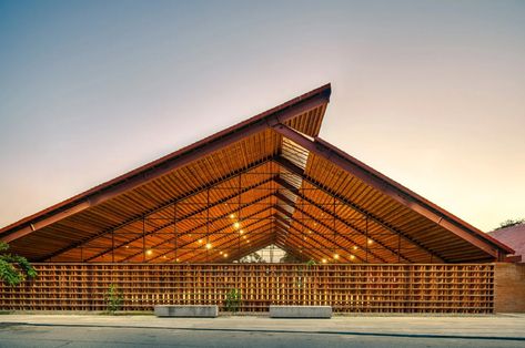 Mexico-based studio Colectivo C733 has built a brick music school called the Casa de Música in Nacajuca, Mexico. The 1325-square-meter school includes two structures and a lofty cantilevered roof created from coconut wood. It "provides a space for social gatherings with warm materials and natural ventilation, while musicians benefit from spacious, isolated classrooms with state-of-the-art equipment,"