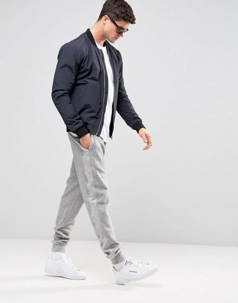 Jogger Sweatpants for Men: The jogger pant has evolved into its own category. It's clothing that feels comfy and looks stylish in and outside of the gym. How do you style fashion joggers? For an initial impression, they’re the ultimate hybrid garment that has shed its gimmicky origins. #Men #MensFashion #joggers #joggerpants #MensPants #DapperConfidential Mens Joggers Outfit, How To Wear Joggers, Jogger Outfit, Trendy Joggers, Gym Joggers, Jogger Pants Outfit, Sweatpants For Men, Streetwear For Men, Herren Style