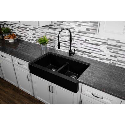 This retrofit farmhouse design with its shorter 6-1/2” apron blends function and form beautifully, and will look stunning in your kitchen. It is designed with a shorter apron to allow it to install into a standard 36” wide sink base cabinet. This farmhouse design is available in a choice of 6 elegant color options to complement any décor. Finish: Black | Karran 34" L x 22" W Farmhouse/Apron Double Basin Kitchen Sink in Black, Size 9.0 H x 34.0 W x 21.25 D in | Wayfair Double Basin Kitchen Sink, Basin Kitchen Sink, Black Kitchen Countertops, Sink Base Cabinet, Apron Sink Kitchen, Farmhouse Apron, Double Bowl Kitchen Sink, Quartz Kitchen, Bowl Kitchen Sink