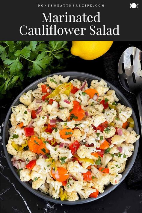 This marinated cauliflower salad recipe is crunchy, tangy, and full of fresh flavor. Perfect for picnics, potlucks, and BBQs. Marinated Cauliflower, Raw Cauliflower Salad, Raw Salad Recipes, Cauliflower Salad Recipe, Picnic Side Dishes, Raw Cauliflower, Cauliflower Salad, Grilled Seafood, Slaw Recipes