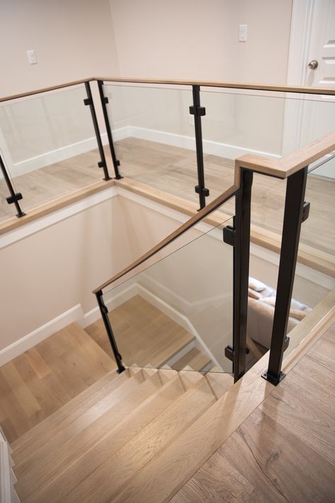 Stair, modern, home, glass railings, metal, posts, glass panels, staircase, design, style, farmhouse, Modern Stairs With Glass Railing, Metal And Glass Staircase, Floating Stairs With Glass Railing, Interior Glass Railing Ideas, Black Metal Interior Stair Railing, Stairway Hallway Decor, Black And Glass Staircase, Indoor Glass Railings, Clear Staircase