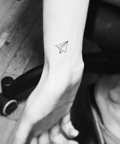 27 Wrist Tattoos That Are Anything But Basic Paper Plane Tattoo, Minimalist Tattoo Meaning, Airplane Tattoo, Meaningful Wrist Tattoos, Plane Tattoo, Cute Tattoos On Wrist, Paris Tattoo, Typography Tattoo, French Tattoo