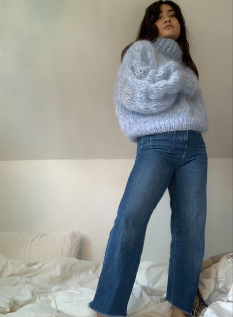 A girl wearing blue jeans and a blue and white mohair sweater inspired by Frisson knits. The sweater is hand knitted and missing a sleeeve Loose Knit Mohair Sweater, Mohair Sweater Knitting Pattern, Mohair Cardigan Knitting Pattern, Mohair Cardigan Pattern, Crochet Mohair Sweater, Mohair Crochet Sweater, Knitting Mohair, Knit Vest Pattern Women, Mohair Sweater Pattern