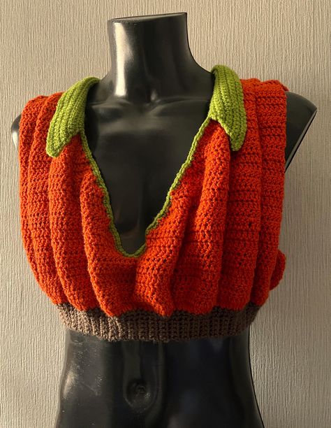 .pdf PATTERN ONLY  English Only   US Crochet Terms Size: 76-148cm/30"-58" Crochet PDF Pattern, Pumpkin Crop Top Skill Level: intermediate This crochet pattern is for a Seasonal Squash inspired crop top. Whether you are heading out for Halloween or spicing up a Thanksgiving Pie, you will want everyone to see you in this Pumpkin Crop Top. The design features multiple 3-D ruffles and a dramatic V-Neck. The collar can be any width you want, so keep it neat or make it big like pumpkin leaves. There i Cobweb Crochet Top, Disenchantment Halloween Costumes, Fall Crochet Projects Clothes, Crochet Cat Halloween Costume, Halloween Crochet Costumes, Ribcage Crochet, Crochet Pumpkin Costume, Crochet Halloween Clothes, Halloween Crochet Top