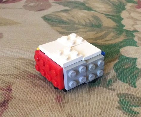 This is my design on how to make a Rubik's cube with Legos. It may be small, but it is a great addition to a cube collection or Lego model collection. This is my... Lego Rubiks Cube, Cake Boxes Diy, Cube 2x2, Boxes Diy, Cake Boxes, Rubik's Cube, Lego Models, Lego Building, Cool Lego