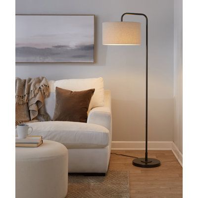 Slender and streamlined, this floor lamp brings a touch of contemporary style as it illuminates any space in your home. Founded atop a round base, this metal fixture features an arched body that props up a single light, while a hardback drum shade up above completes the understated design and diffuses its brightness. Some assembly is required, and this luminary does not include a compatible 100W incandescent bulb. Langley Street® Shade Color: Natural Linen, Finish: Oil Rubbed Bronze | Langley St Dining Room Floor Lamp, Standing Lamp Living Room, Pole Lamps, Tall Floor Lamps, Stylish Floor Lamp, Corner Lamp, Industrial Floor Lamps, Tall Lamps, Floor Lamps Living Room