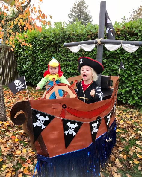 My grandsons and their pirate ship float red wagon heading out to pillage the neighborhood for candy booty! 🎃 Pirate Wagon, Pirate Ship Wagon, Pirate Ships Diy, Wagon Floats, Mardi Gras Parade Float, Cardboard Pirate Ship, Hay Wagon, Dungaree Outfit, Polo Bodysuit