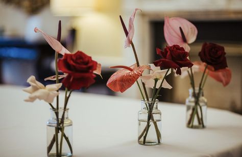 reflexed roses and anthurium Anthurium Centerpiece, Anthurium Wedding Decor, Anthurium Arrangement Wedding, Bud Vases Red Flowers, Red Anthurium Centerpiece, Reflexed Roses, Pink Anthurium Arrangement, Anthurium Bouquet, Vase Display