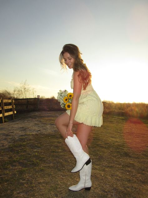 Spring. Flowers. Sunflowers. Pink flowers. Trader joes. Trader joes flowers. Yellow dress. Sundress. Field pictures. Spring aesthetic. Coastal cowgirl. Cowboy boots. White cowboys boots. Prairie. Picnic photoshoot. Tall grass. Girls day. Outfit With Cowgirl Boots, Trader Joes Flowers, Cowboy Boots White, Sunflower Outfit, Field Pictures, Cowboys Boots, Picnic Photoshoot, Flowers Sunflowers, Aesthetic Coastal