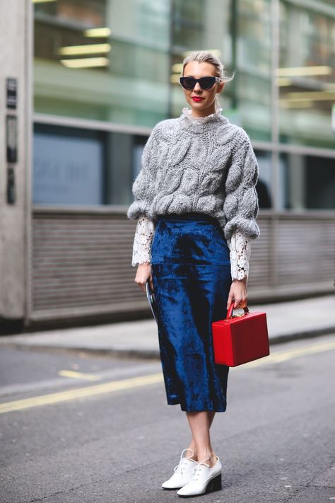 New Ways To Wear Clothes You Were About To Retire #refinery29  http://www.refinery29.com/unexpected-street-style-styling-tips#slide-9  Spruce up a chunky knit that's seen better days with a pretty lace top underneath and a fancier velvet skirt.... Velvet Skirt Outfit, London Fashion Week Street Style, London Fashion Weeks, Rock Outfit, Velvet Clothes, Red Bag, London Street Style, Looks Street Style, The Best Street Style