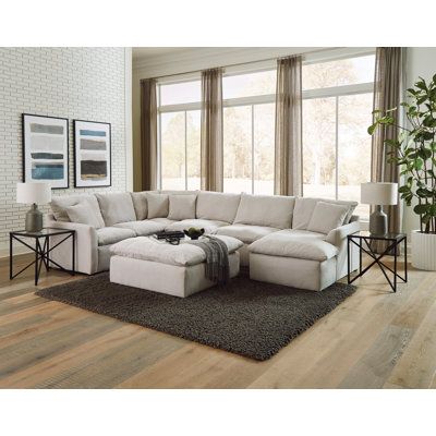 This ultra-modern convertible sofa and chaise set offers a cozy spot for you and your guests to unwind. The U-shaped design is crafted with a solid and engineered wood frame, and it's upholstered in polyester fabric in a versatile gray hue. The pillow-soft reversible seat tops feature individually pocketed coil springs integrated into the base, providing added support and comfort. This set comes with four toss pillows for a touch of extra relaxation. Plus, the padded ottoman is ideal for kicking 3 Piece Sectional Sofa, Sectional Chaise, Sectional With Ottoman, Grey Sectional, Fabric Sectional, 3 Piece Sectional, Furniture Market, Upholstered Sectional, Living Room Set