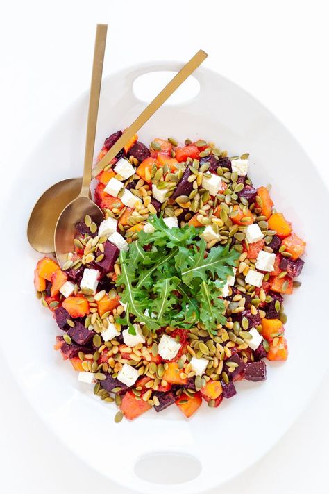 This hearty Roasted Pumpkin and Beetroot Salad recipe features roasted pumpkin (squash) and beetroot (beets) that has been tossed in a delicious maple vinaigrette and topped with feta, pine nuts, pepitas and arugula (rocket). The perfect fall/winter salad or holiday side dish - beautiful and easy to make! | www.mapleandmango.com Roast Pumpkin Salad, Maple Vinaigrette, Winter Salad Recipes, Holiday Side Dish, Pumpkin Squash, Squash Salad, Beetroot Salad, Holiday Side, Roasted Pumpkin