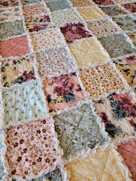 Elegant florals, meandering vines, and playful geometric shapes come together to create the Country Roads large rag quilt throw. The vintage yellows, pale blue, pastel pinks, soft greens, and accents of brick red will leave you longing for the countryside. This quilt is absolutely breathtaking! This large throw rag quilt measures approximately 60 x 75 inches. Visit my Etsy shop for more rag quilts and knitted socks, scarfs, and mittens. Perfect for holiday gifting too! Rag Quilts For Beginners, Rag Quilt Patterns, Rag Quilts, Knitted Socks, Blue Pastel, Creating Memories, Tucson Arizona, Quilting For Beginners, Rag Quilt