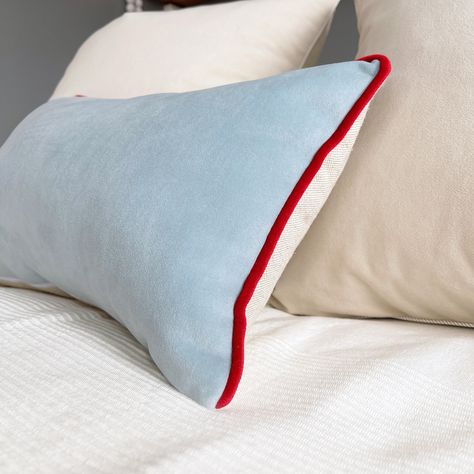 Soft and airy bedroom. Create a light and cozy atmosphere with this baby blue velvet lumbar pillow cover. The light blue velvet is plush yet sturdy and thick. The contrasting red velvet piping makes the cushion a beautiful classy accent for any bed or chair. A sweet accent for the baby nursery or a pastel living room to bring both serenity and vivid details. This quality Italian velvet lumbar cushion cover can be a great gift for a new baby or the best friend. Details: - pillow cover: various si Light Blue Bedding, Blue Velvet Pillow, Red Nursery, Pastel Living Room, Velvet Lumbar Pillow, Baby Room Curtains, Light Blue Pillows, Cord Light, Red Bedding