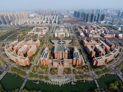 Dramatic drone pictures capture China's largest university  Can you imagine studying with 72,600 schoolmates in one campus? /  The Zhengzhou University have about 72,600 enrolled students in Zhengzhou, Central China’s Henan Province.   In 2016, the Zhengzhou University has about 56,000 undergraduates, 15,000 graduates and 1600 foreign student from over 60 Countries and regions.  The 3.8 square kilometers campus has over 160 teaching building and dormitory, three the stadium, two park with lake. Drone Pictures, School Building Design, Zhengzhou, School Building, Medical University, University Campus, Digital Signage, Student Life, City Skyline