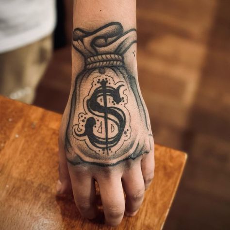 Yung Chavo on Instagram: "Healed 💰 done a while back @timeless_gallery ‼️… Hit my DM to book appointments for February‼️ LETS WERK💰💯… - #YUNGCHAVO #TATTOOS #ART #INKED #MONEYBAG #BLACKNGREY #LOSANGELES" Money Bag Hand Tattoo, Moneybag Tattoos, Money Bag Tattoo, Mexican Tattoo, Tattoo Shading, Money Tattoo, Tattoo Lettering Fonts, Tattoos Art, Hand Tattoos For Guys