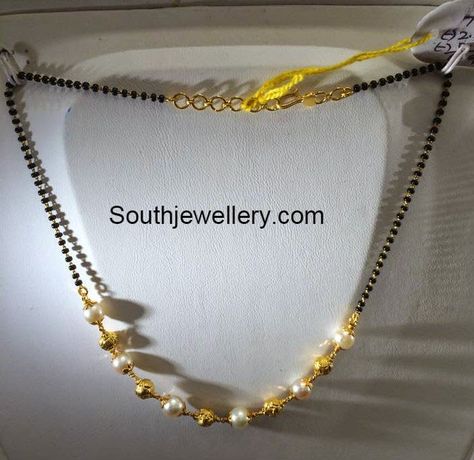 22 carat gold light weight simple black beads mangalsutra chain strung with gold balls and south sea pearls from Premraj Jewellers. Weight: 5 grams For inquiries contact on Whatsapp: +91 97 00 009000 or Email: dharmesh25@yahoo.com Related PostsBlack Beads Mangalsutra DesignsShort Black Beads ChainShort Light Weight Mangalsutra Chains5 Grams Black Beads Mangalsutra ChainsSimple Black Beads Simple Black Beads, Black Beads Mangalsutra, Black Beads Mangalsutra Design, Gold Jewelry Simple Necklace, Gold Mangalsutra Designs, Gold Necklace Indian Bridal Jewelry, Gold Mangalsutra, Beaded Necklace Designs, Mangalsutra Designs