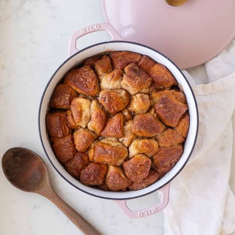 Made with canned biscuit dough, a butter brown sugar sauce, and cinnamon sugar, this pull-apart Dutch Oven Monkey Bread is an easy breakfast. Monkey Bread Dutch Oven, Dutch Oven Monkey Bread, Monkey Bread With Canned Biscuits Easy, Monkey Bread Breakfast, Breakfast Monkey Bread, Monkey Bread With Canned Biscuits, Dutch Oven Breakfast, Biscuit Monkey Bread, Brown Sugar Sauce