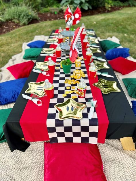 Mario Go Kart Birthday Party, Super Mario Party Table Decorations, Mario Kart 8 Birthday Party, Super Mario Bros Party Table Ideas, Mario Birthday Party Table Set Up, Mario Party Goodie Bags, Backyard Mario Party, Mario Birthday Party Aesthetic, Mario Kart Centerpiece