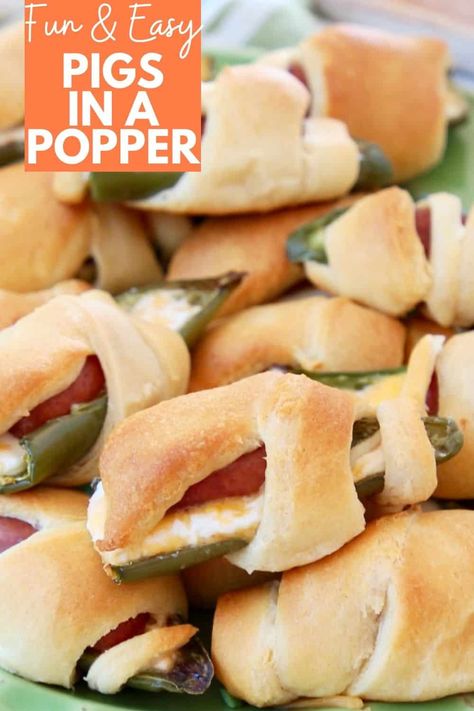 Combine two appetizer favorites into one with Jalapeno Popper Pigs in a Blanket! Roasted jalapenos are filled with cheese and little smokies, then wrapped in crescent rolls for an easy recipe that is sure to impress your friends! Great for gameday or parties! Popper Pigs In A Blanket, Tailgating Snacks, Roasted Jalapenos, Friends Recipe, Little Smokies Recipes, Superbowl Recipes, Appetizer Easy, Smokies Recipe, Indulgent Recipes