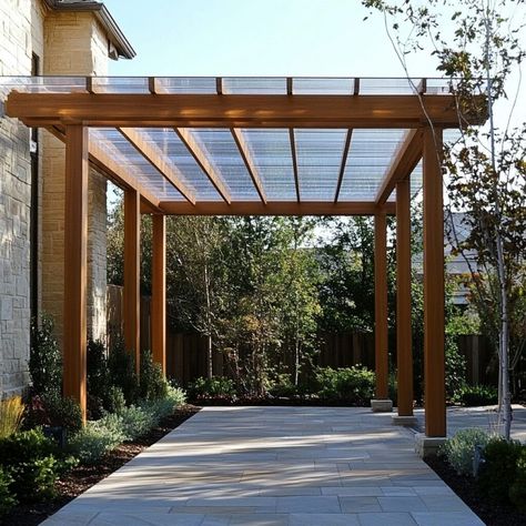 Discover how polycarbonate can elevate outdoor spaces with this modern pergola design. Using durable polycarbonate panels, this structure offers UV protection, natural light filtration, and weather resistance, making it ideal for patios, walkways, and garden areas. Combined with a sleek wood frame, the polycarbonate roofing provides a stylish, functional addition to any outdoor setting, perfect for those seeking contemporary aesthetics and long-lasting material building solutions. Polycarbonate Pergola Roof, Pergola With Polycarbonate Roof, Polycarbonate Pergola, Building Materials Architecture, Modern Pergola Designs, Polycarbonate Roof Panels, Polycarbonate Roof, Garden Areas, Modern Pergola