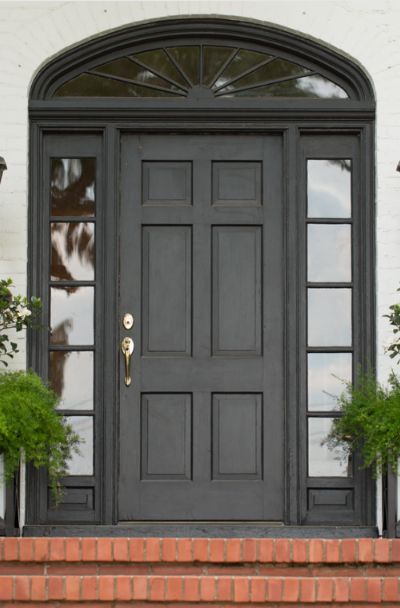 31 Houses With Black Front Entry Door Ideas | Sebring Design Build Black Front Door Entrance, Black Metal Entry Door, Black Exterior Doors Front Entry, Black Front Doors Exterior, Arched Front Door Entryway, Black Front Door Ideas, Entry Door Ideas, Black Entry Door, White Oak Front Doors