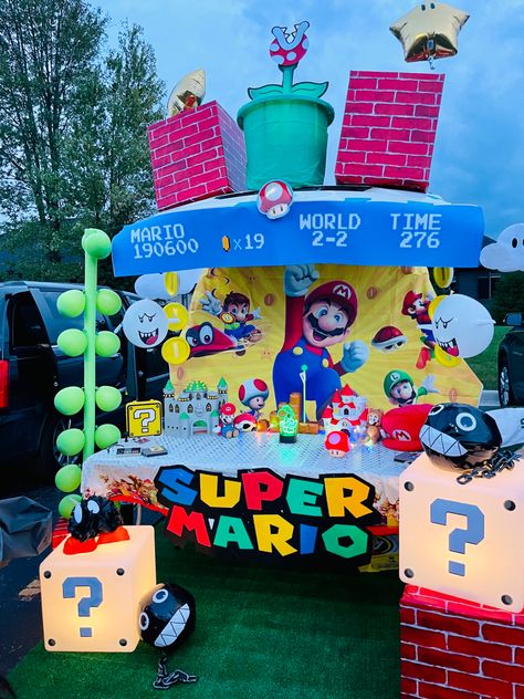 Mario Halloween Trunk Or Treat, Mario Truck Or Treat, Mario Kart Golf Cart Decor, Super Mario Golf Cart, Trunk Or Treat Super Mario Theme, Mario Parade Float Ideas, Super Mario Parade Float, Super Mario Bros Parade Float, Mario Golf Cart Decorations