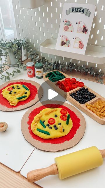 Engaging Elodie on Instagram: "Elodie loved our pizza mud kitchen a few weeks ago so this week I reused the ‘pizza bases’ for an indoors activity! 🍕  The cheese is home made playdough (message me if you want the recipe)! And all the toppings are pasta/chickpeas covered in paint.   A lovely activity for developing fine motors skills and creative/imaginary play. 🍕💛  #playdoughplayactivities #sensoryplay #messyplay #toddleractivities #reelsdaily #finemotorskills #prewritingskills #creativeplay #learningthroughplay #toddlerdevelopment #playbasedlearning #homeeducation" Playdough Ideas For Kids, Cooking Experience Preschool, Pizza Activities For Preschool, Pizza Activities For Kids, Home Made Playdough, Pizza Playdough, Pasta Sensory Play, Pizza Making Activity Preschool, Pizza Role Play