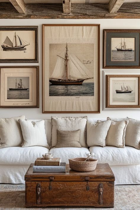 Explore unique coastal gallery wall inspiration featuring various art pieces and décor styles that evoke the essence of the beach and ocean. Rustic Coastal Decor Living Room, Coastal Americana Decor, Coastal Western Decor, Classy Coastal Decor, Moody Coastal Decor, Coastal Grandma Chic, Vintage Beach House Decor, Beachy Artwork, Farmhouse Beach Decor