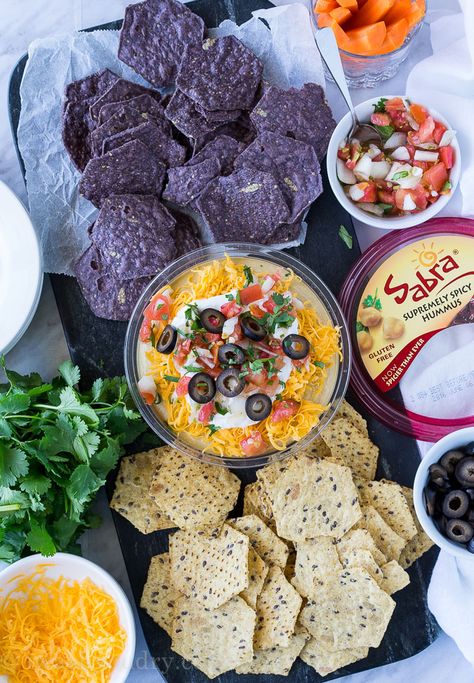 This is by far the easiest way to have your #unofficialmeal. This easy Mexican Layered Hummus Dip starts with a tub of Sabra hummus and is piled high with all the classic taco fillings! So good! Layered Hummus Dip, Layered Hummus, Sabra Hummus, Spicy Hummus, Hummus Dip, Taco Fillings, Easy Dips, Easy Mexican, Spread Recipes