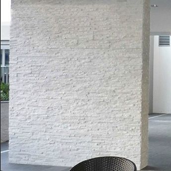 Modern white stone feature wall,ideal for fires (chimney breasts) or outdoor walls. White Stone Cladding Exterior, White Stone Cladding, White Stone Tiles, Stone Cladding Exterior, Stone Feature Wall, Indoor Swimming Pool Design, Exterior Wall Cladding, Tile Cladding, Stone Tile Wall