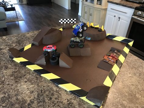 Monster Truck Track DIY Cardboard Monster Truck Track, Diy Monster Truck Arena, Diy Monster Truck, Monster Truck Games, Boy Activities, Monster Jam Birthday Party, Monster Jam Toys, Monster Jam Birthday, Monster Truck Kids