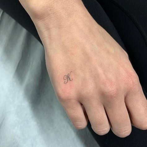 Tiny Tattoos Letters, Tiny K Tattoo, Hand Initial Tattoo, Cursive S Tattoo, Dainty Letter Tattoo, Letter Tattoos On Hand, Dainty Tats, Letter K Tattoo, Small Letter Tattoo