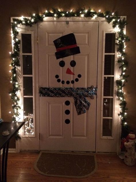 Front Door Wrapped Like A Christmas Present, Snowman Bedroom Door, Chrismass Decore Ideas Front Door, Snowman Front Door Decor, Christmas House Door Decorations, Snowman On Door Diy, Door Present Decoration, Indoor Christmas Door Decorations, Christmas Door Decor Ideas For Home