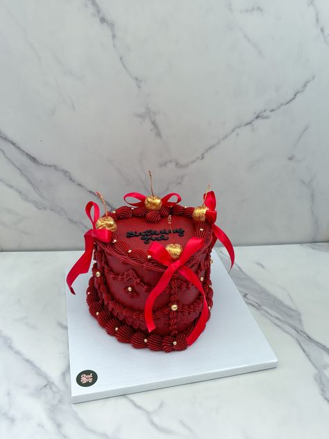 Dark red heart cake with gold glitter cherries and red ribbon bows Red Vintage Heart Cake, Gold And Red Cake, Red And Gold Birthday Cake, Red Gold Cake, Red And Gold Cake, Red Heart Cake, Glitter Cherries, Dark Red Heart, Victorian Cakes