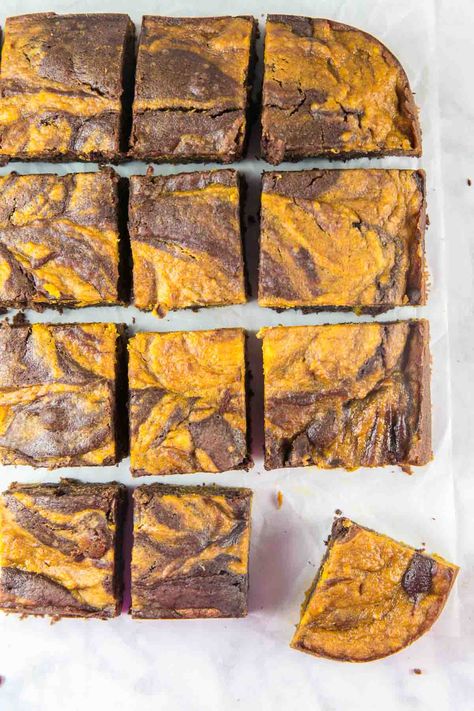 pumpkin swirl brownies on a white background lined up in a square with one corner brownie pulled out Halloween Dinner Party Menu, Pumpkin Swirl Brownies, Pumpkin Brownies, Swirl Brownies, Potluck Desserts, Vegetarian Bake, Harvest Pumpkin, Baking Cocoa, Pumpkin Chocolate Chips