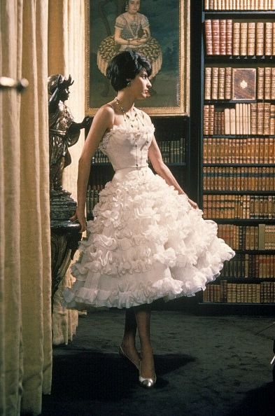 Model is wearing a frothy, tiered party dress by Chanel, 1960 Chanel 2020, 1960 Dress, Fashion 1960s, Mode Chanel, Chanel Dress, Look Formal, Chanel Couture, Vintage Couture, 1960s Fashion