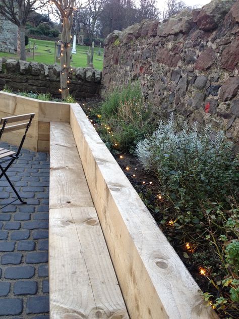 Chunky wooden sleepers - seating incorporated into raised bed. Nice cobbled path too. Steampunk, North Berwick Sleepers Garden Ideas, Retaining Walls Ideas, Garden Sleepers, Cheap Retaining Wall, Sleepers Garden, Railway Sleepers Garden, Sleeper Wall, Small Retaining Wall, Sleeper Retaining Wall