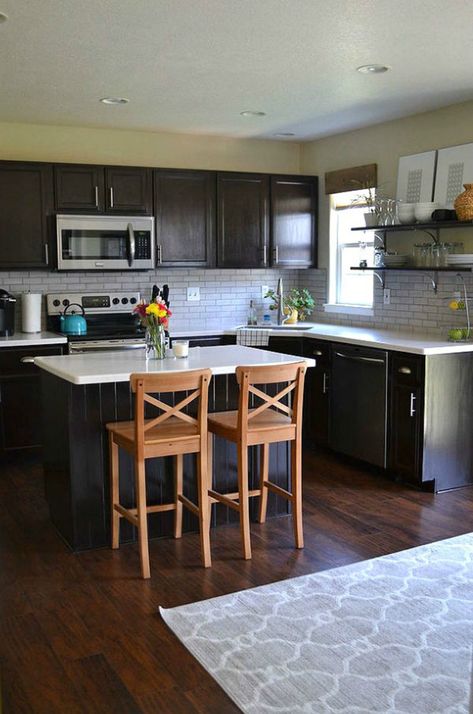 7 Budget Ways to Make Your Rental Kitchen Look Expensive Tips | ForRent Java Kitchen Cabinets, Small Kitchen Dark Cabinets, Small Kitchen Dark, Dark Cabinets Light Counters, Kitchen Decor For Dark Cabinets, Kitchen Dark Cabinets, Light Countertops, Dark Cabinets Light Countertops, Rental Kitchen