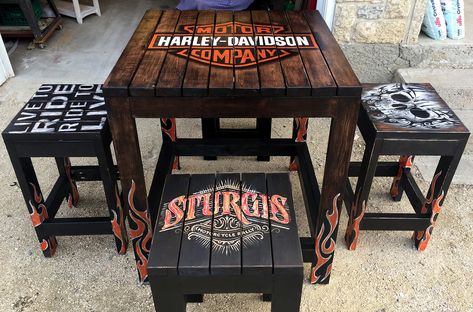 Harley Davidson Table and Chairs. Hand painted by Angie Zubrin. Zubrin Design on Facebook. Harley Davidson Furniture Ideas, Harley Davidson Home Decor, Harley Davidson Table, Mechanic Shop Decor, Harley Davidson Decals, Harley Davidson Decor, Wood Pallet Crafts, Harley Davidson Crafts, Cabin Plans With Loft