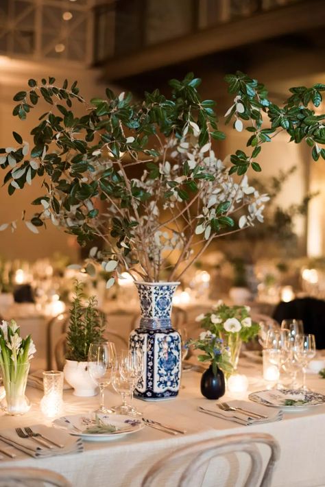 34 Affordable Centerpieces for Any Wedding Style Asian Inspired Wedding Decor, Picture Centerpieces Wedding, Wedding Centerpieces Cheap, Cheap Table Centerpieces, Tree Centerpieces Wedding, Tree Branch Wedding Decor, Tree Centrepiece Wedding, Affordable Centerpieces, Branches Wedding Decor