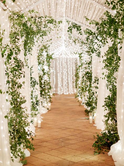 Using twinkle lights can enhance your wedding venue and wedding decor. Click to see 19 ideas of how to use twinkle lights throughout your wedding to upscale your wedding decor. #Wedding #Ideas #Details #TwinkleLights #Ceremony #ChristmasLights #SmallLights #WeddingVenue #WeddingDecor | Martha Stewart Weddings -  Dazzling Ways to Use Twinkle Lights Throughout Your Wedding Timber Arbour, Kiara Wedding, Walkway Decor, Natural Wedding Decor, Winter Wedding Table, Rustic Wedding Decorations, Wedding Entrance Decor, Wedding Entrance, Wedding Forward