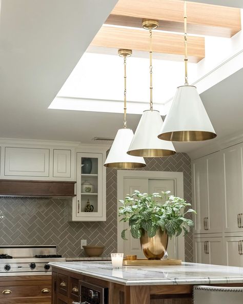 rebecca gibbs on Instagram: “We added personality and light to this remodel by making this skylight much larger and adding beams with pendants suspended from them. 🤍🤍🤍…” Skylights With Pendants, Chandelier In Skylight, Skylight With Beams, Skylight With Pendant Light, Kitchen Skylight Flat Ceiling, Skylights Over Kitchen Island, Skylight Over Kitchen Island, Interior Skylight Design, Kitchen With Skylight Natural Light