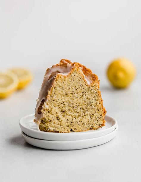 This easy lemon poppy seed Bundt Cake is a great recipe to make for brunch or dessert! This cake is made from scratch, using sour cream, which makes the cake extra moist. Top the lemon cake with a smooth glaze and you have yourself one of the best citrus cakes around! Lemon Poppy Seed Bundt Cake Recipe, Lemon Poppyseed Bundt Cake, Poppyseed Bundt Cake, Lemon Poppy Seed Bundt Cake, Coffee Cake Bundt, Poppy Seed Bundt Cake, Lemon Juice Uses, Citrus Cake, Lemon Poppyseed Cake