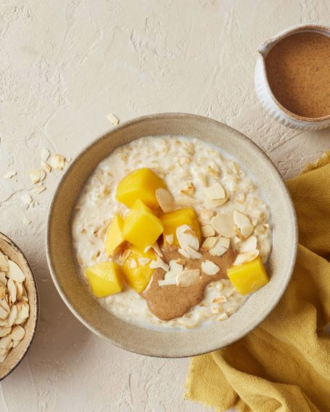 Tropical Mango Porridge - amelia freer Healthy Porridge Recipes, Healthy Porridge, Mango Oatmeal, Amelia Freer, Coconut Milk Drink, Healthy Skin Diet, Fancy Breakfast, Veggie Breakfast, Skin Diet