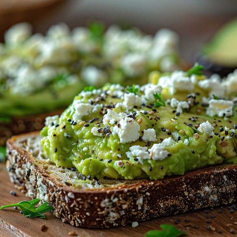 This Mediterranean twist on the popular avocado toast incorporates the tangy flavor of Greek feta cheese. Avocado And Feta Toast, Mediterranean Breakfast Toast, Avocado Feta Toast, Avocado Toast With Feta, Mediterranean Diet Breakfast Ideas, Mediterranean Toast, Feta Toast, Mediterranean Diet Breakfast Recipes, Diet Breakfast Ideas