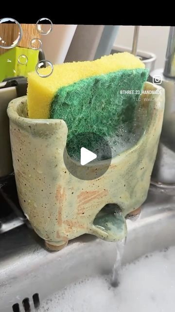 Love in Pottery on Instagram: "by @three.23_handmade In a cozy nook by the silver sink, Stands a pottery piece, a link. A potter’s hands, now still, admire The sponge holder’s simple desire.  Ceramics cradle, froth and foam, A watery cascade, its effervescent dome. Earth’s gift, fired and glazed, In mundane life, beauty raised.  Bubbles dance on earthen skin, New life for sponges, a fresh begin. This crafted haven, a potter’s mold, Holds the sponge, a story untold. FOLLOW👉 @loveinpottery for more pottery contents ☕️ !  visit their page and support 💕  Follow us on @musthomeguide (Interior Lovers) & @mustvisitguide (Travel Lovers) !  #instapottery #ceramicsculpture #craft #contemporaryceramics #handmade #glaze #design #art #pottery #ceramicartist #tableware #ceramique #interiordesign #cera Bathroom Pottery, Simple Pottery, Sponge Glaze Ceramics, Sponge Holder Fr, Sponge Dish Ceramic, Ceramic Sponge Holder, Sponge Holder Ceramic, Ceramic Sponge Holder Pottery, Pottery Toothbrush Holder