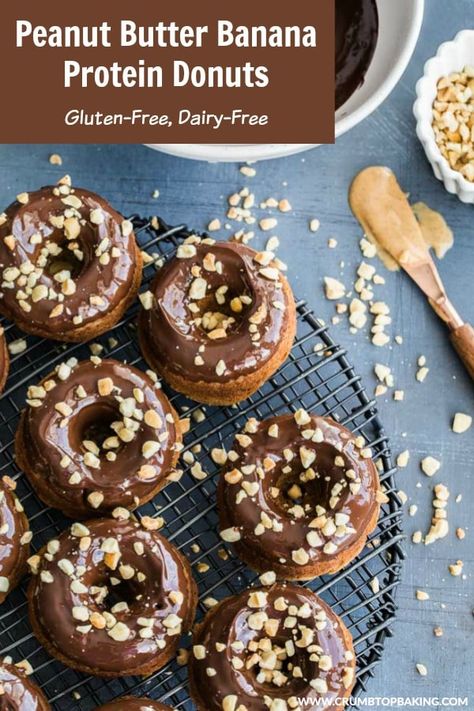 Peanut Butter Banana Protein Donuts are soft and fluffy, with a hint of banana and topped with a thick chocolate peanut butter glaze. They're also gluten-free and dairy-free, and made with wholesome ingredients. Perfect for that mid-afternoon sugar craving! #crumbtopbaking #proteindonuts #pronuts #healthydesserts #peanutbutter #dairyfree #glutenfree High Protein Donuts, Peanut Butter Banana Protein, Protein Donuts Recipe, Peanut Butter Glaze, Low Carb Donut, Paleo Breakfasts, Donut Calories, Low Calorie Protein, Banana Butter