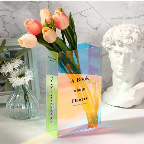 Book Lovers Gifts!! The beautiful vase is designed with the shape and texture of a book, subtly blending cultural art and modern aesthetics, making it easy to fit into any decor space. Perfect for book lovers!
#booktok #flower #decor #homeoffice #bookshelf #books #bookaesthetic #interiordesign #backlist #officegifts #officedesign #desktrinkets #bookends #organization #giftsforher #giftsforwife #giftsforgirlfriend #cutegifts #cheapgifts #bridalshower #weddinggifts #homewarminggifts #housewarming Flower Vase Aesthetic, Book Flower Vase, Cute Flower Vase, Aesthetic Vase, Vase Aesthetic, Vase Cute, Cute Vase, Flower Shop Decor, Acrylic Vase