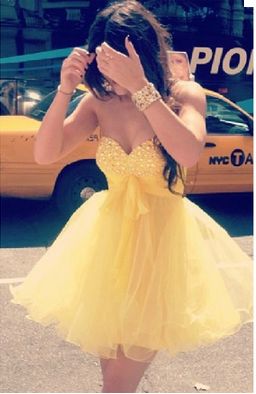 Short poofy fairy-like dresses in a neutral color (to avoid looking cheesy/tacky) for my bridesmaids! Homecoming Dresses Yellow, Prom Dress Yellow, Cute Prom Dress, Yellow Homecoming Dresses, Crystal Prom Dress, Poofy Dress, High Low Prom Dresses, Prom Dresses Yellow, Prom Dresses 2017